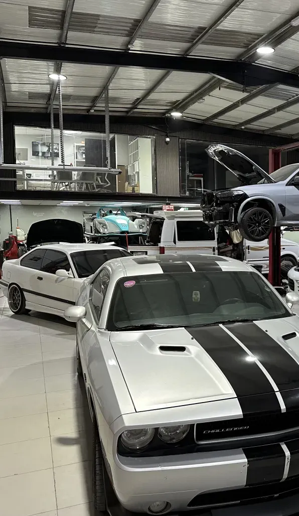 Muscle car parked in the workshop